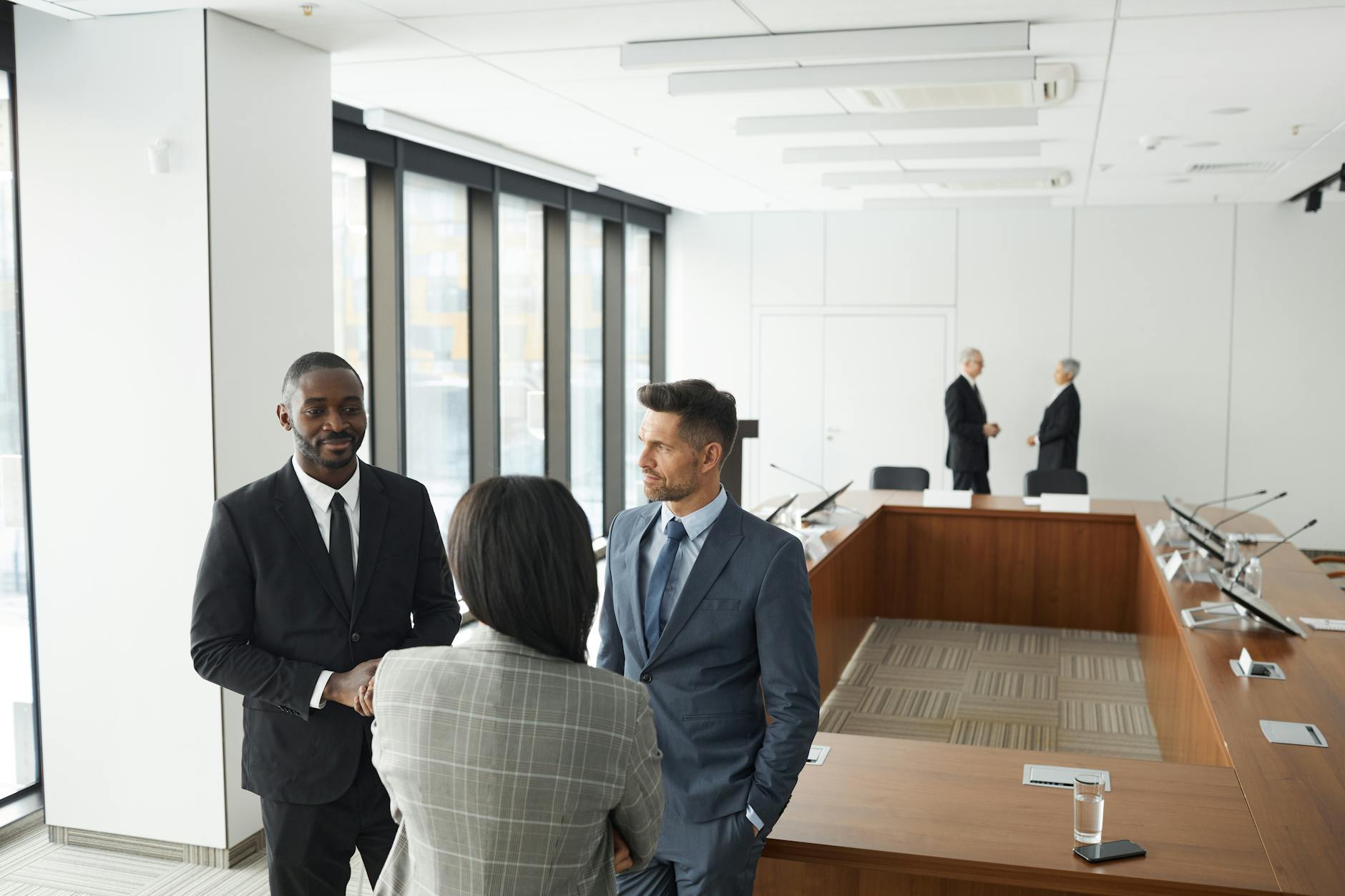Corporate executives in professional meeting setting