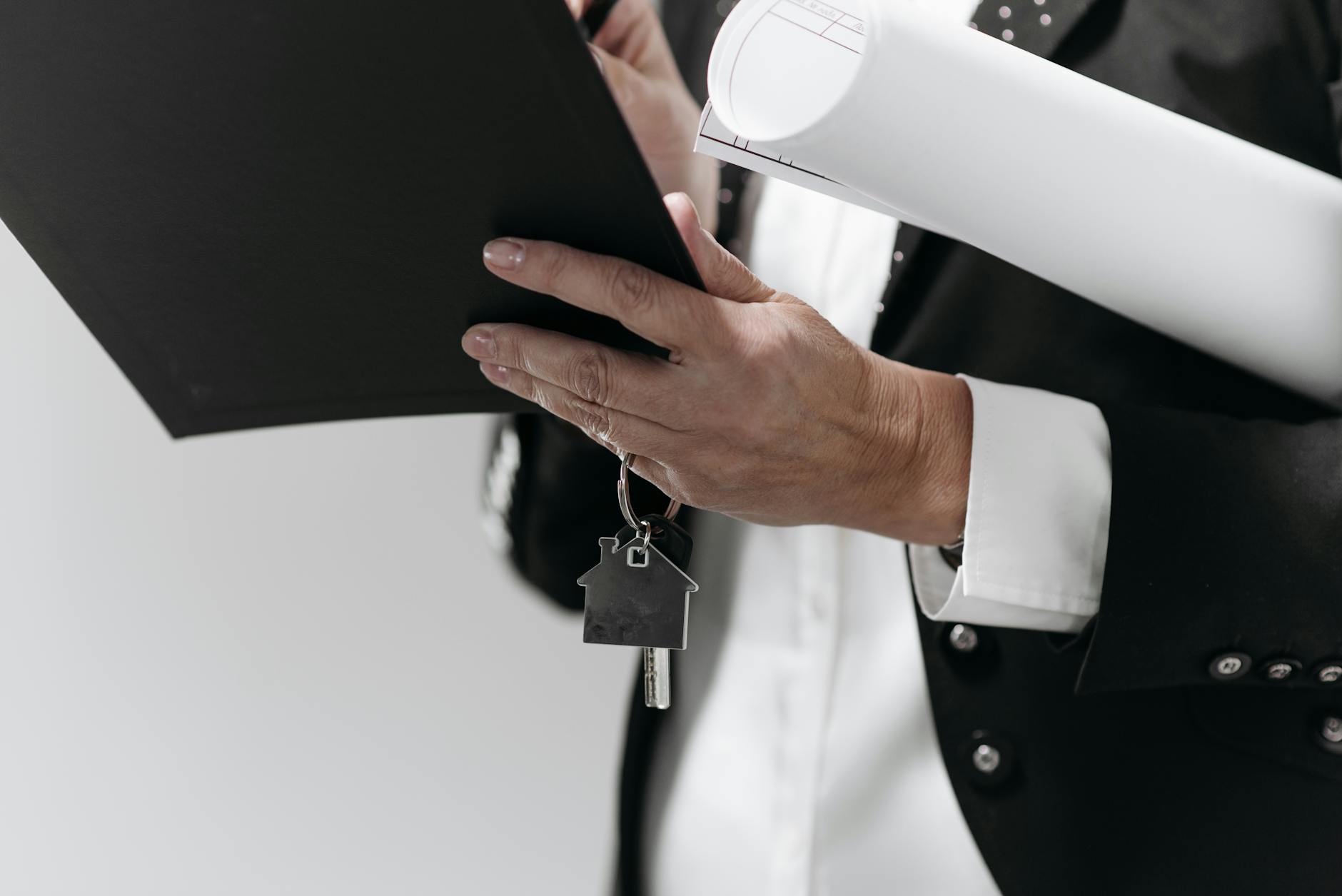 House keys and mortgage documents on wooden table