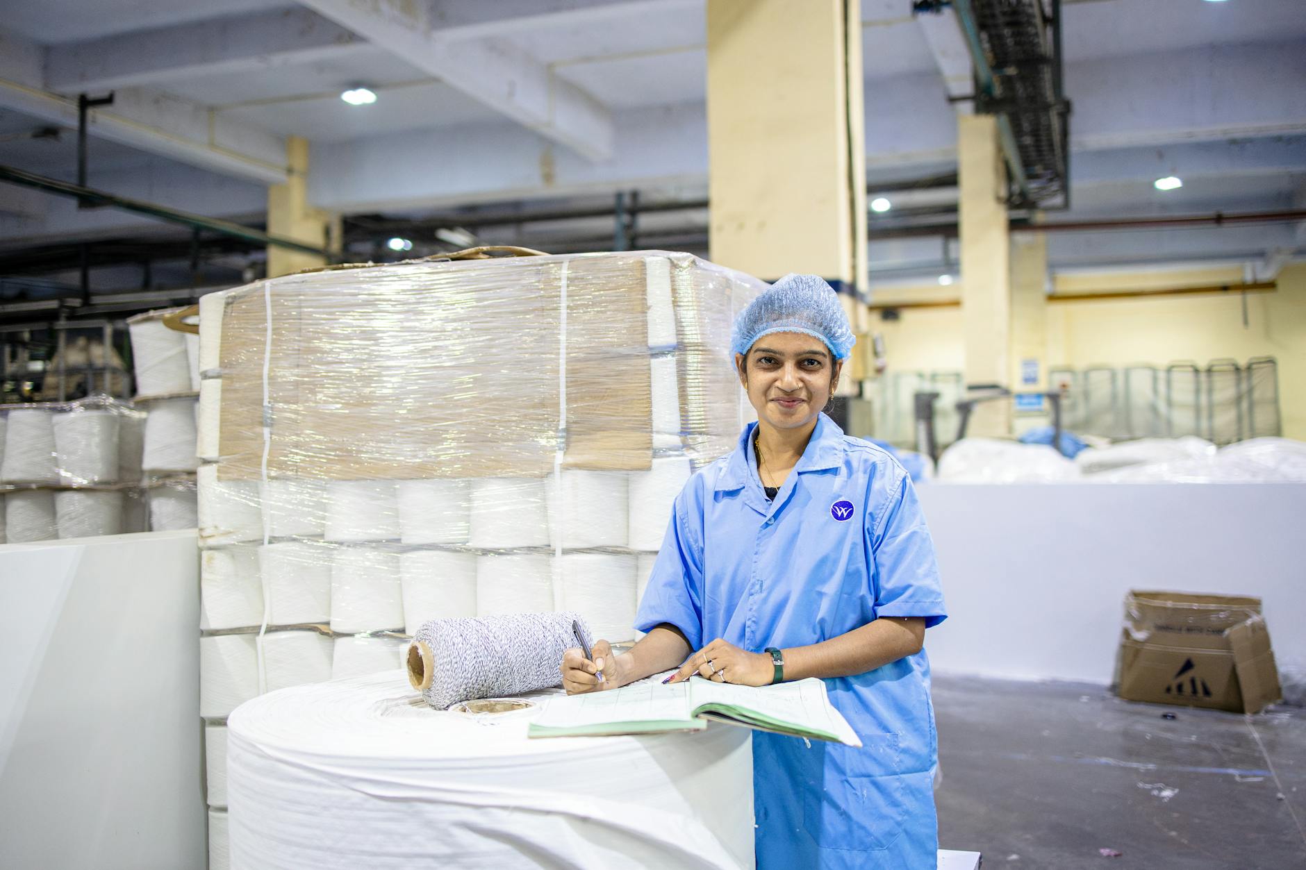 Food safety inspector examining vegetables on production line