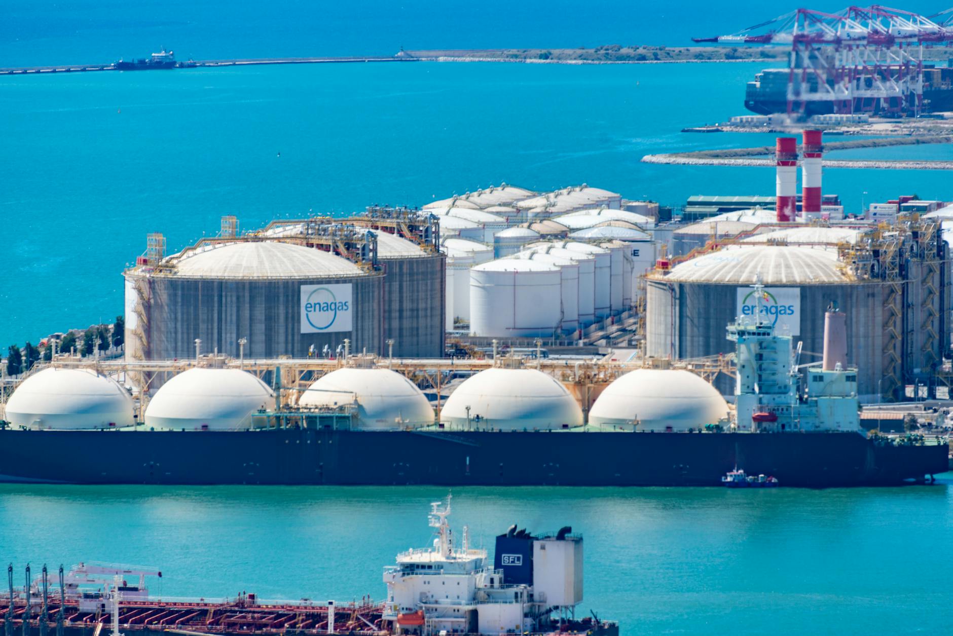 Industrial fuel storage tanks at maritime terminal facility