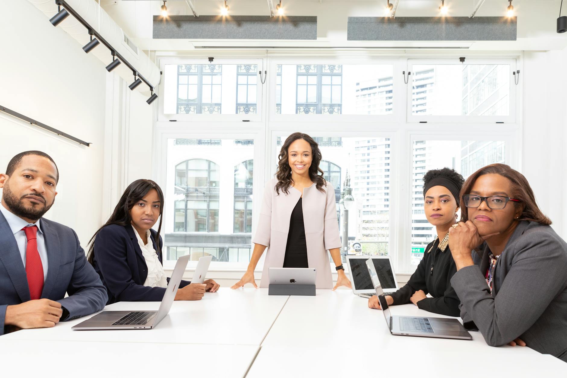 Professional business meeting with documents and analysis materials