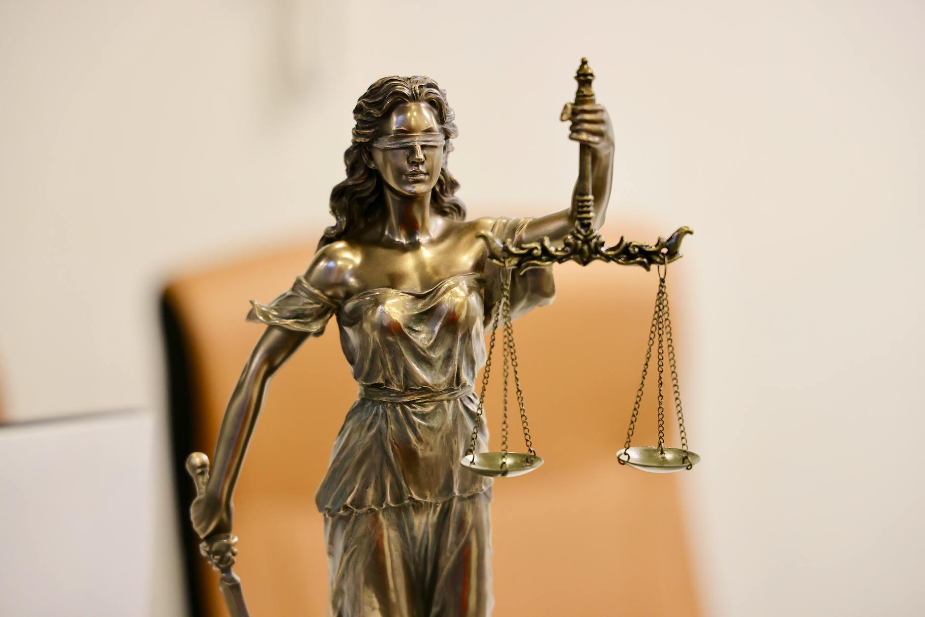 Federal courthouse steps with justice statue