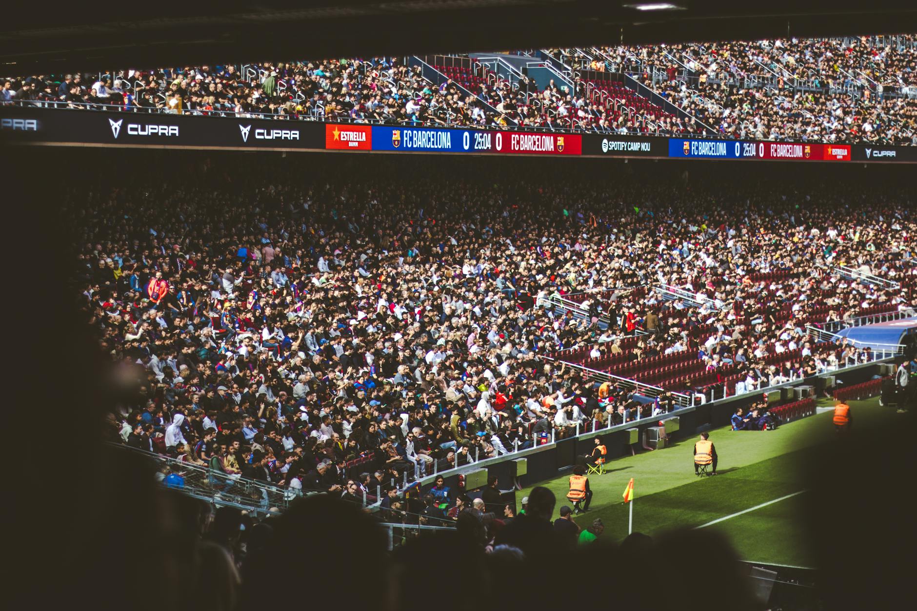 Large crowd at international sporting event with media coverage