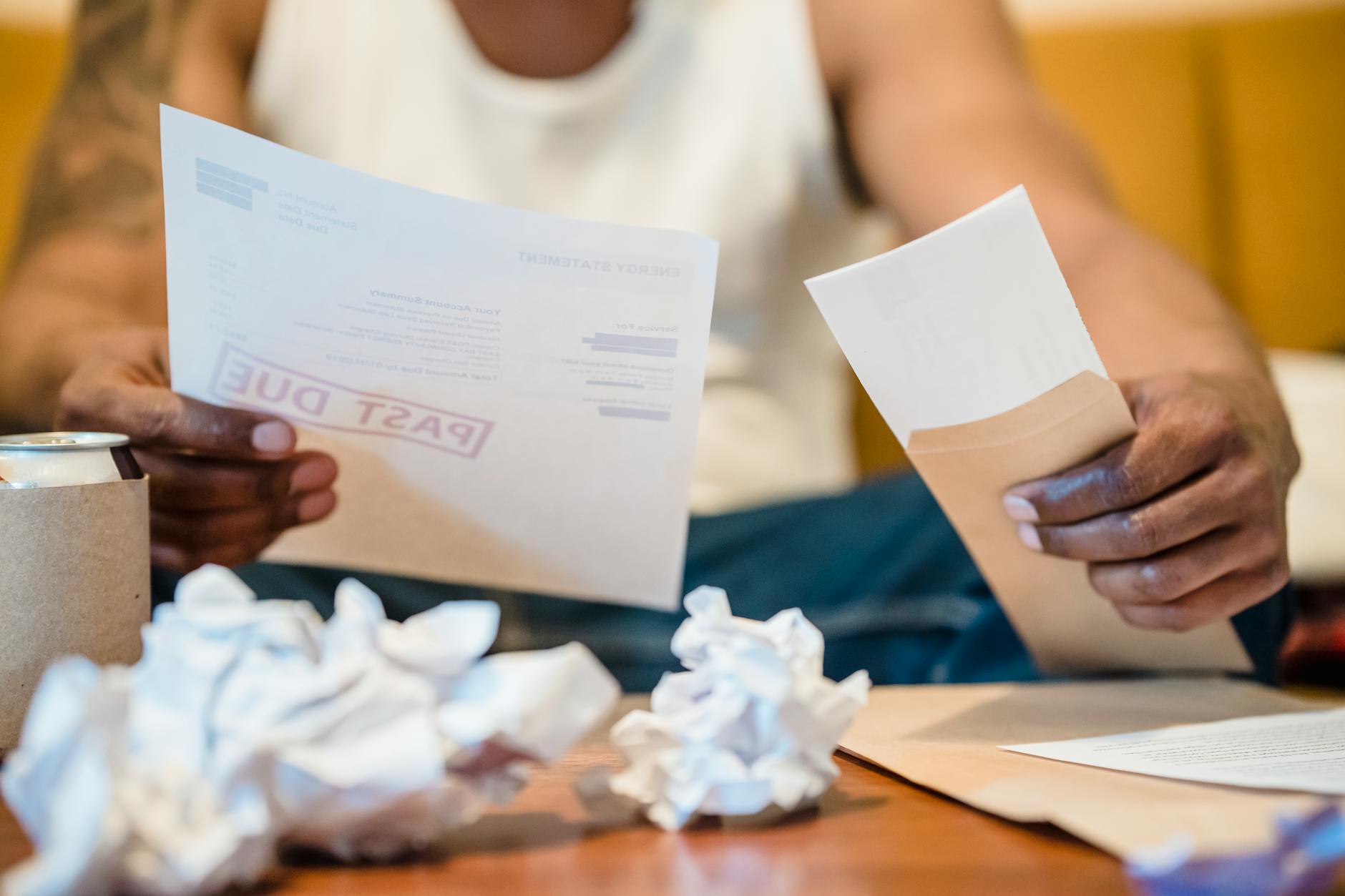 Person reviewing monthly electricity bill statement
