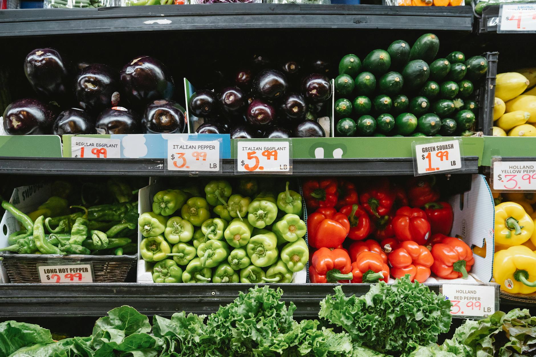 Fresh lettuce displays in supermarket refrigerated produce section