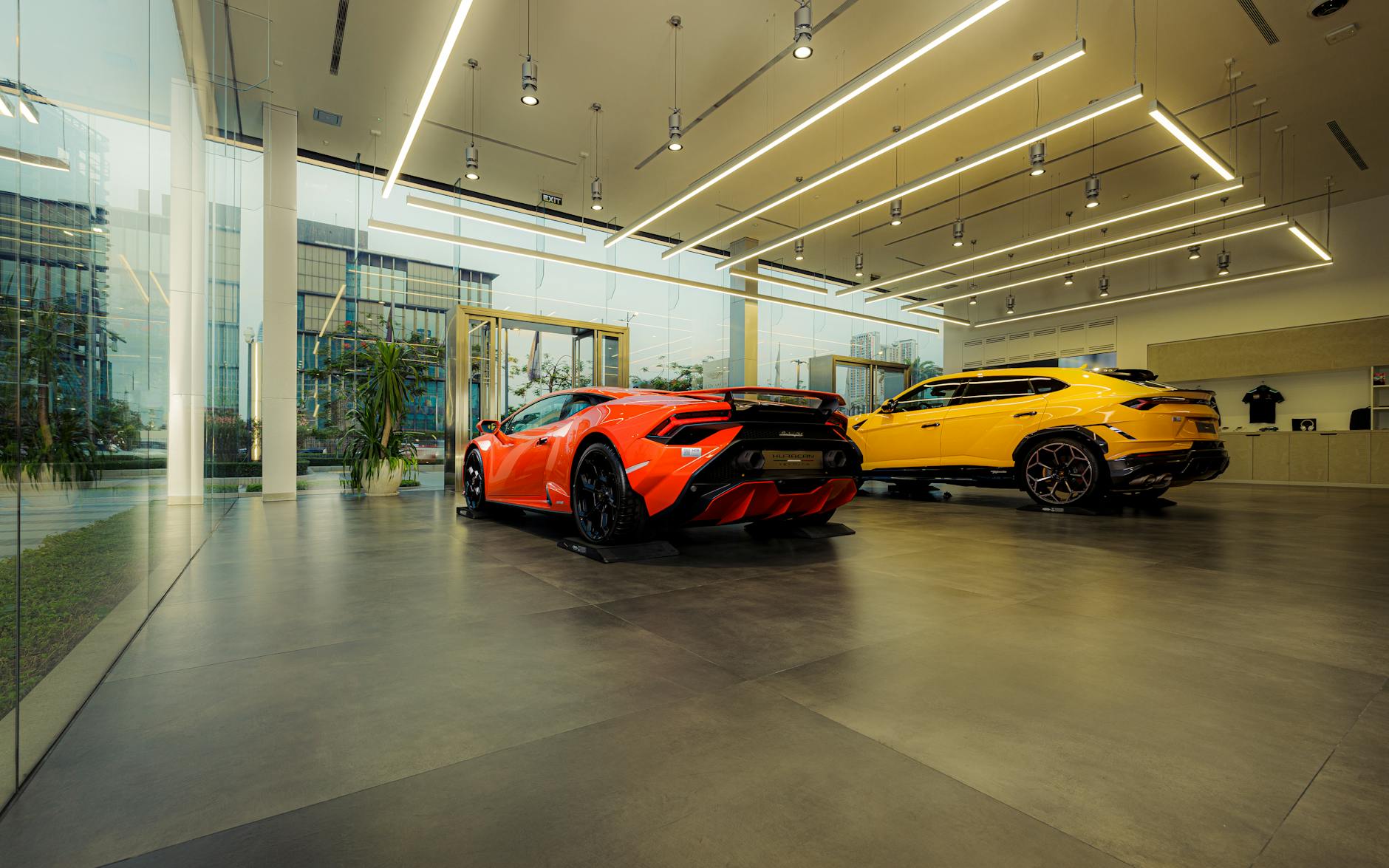 High-end vehicles displayed in a modern automotive showroom
