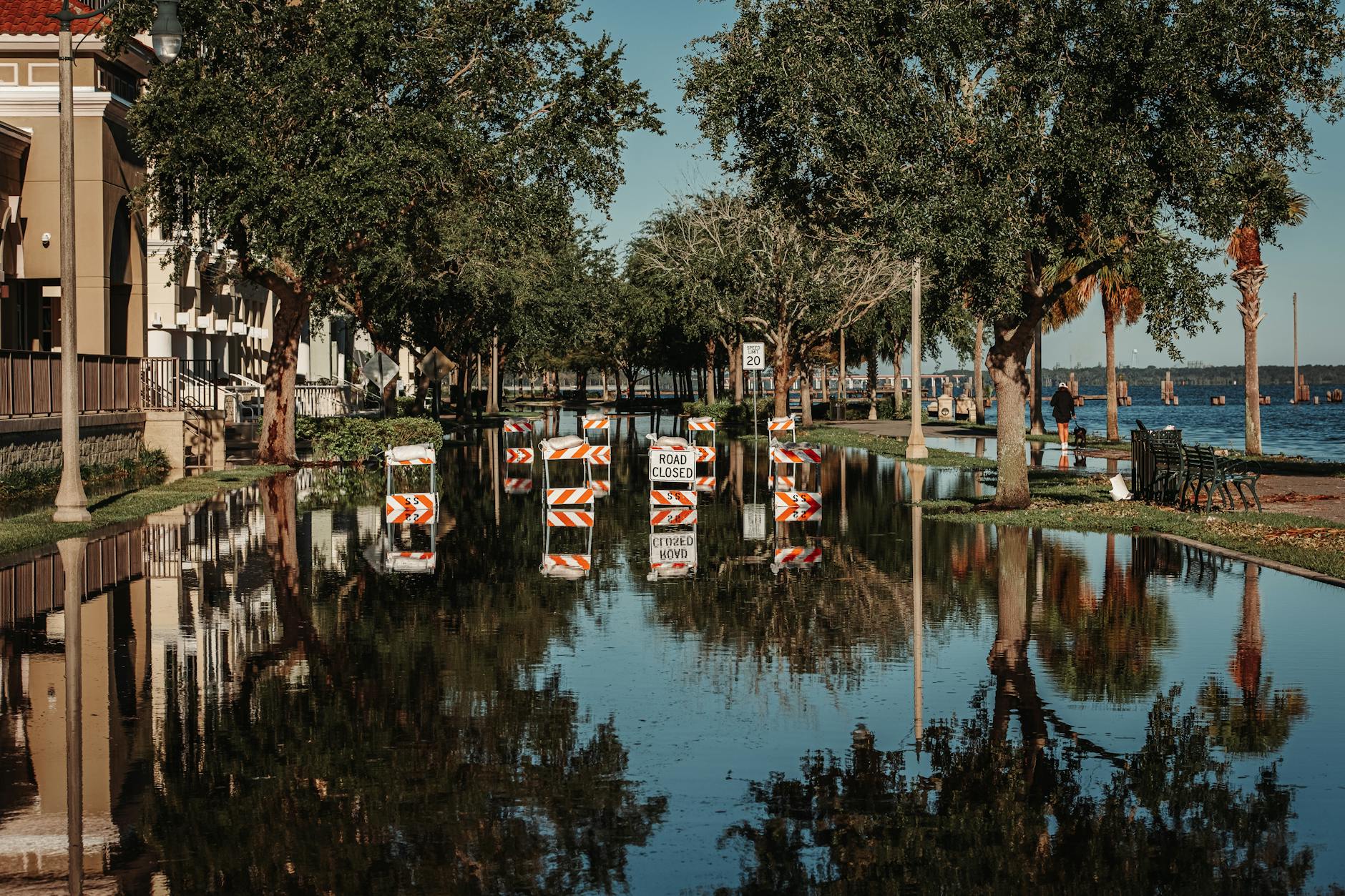 Flooded road and damaged infrastructure after extreme weather event