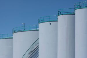Large commercial crude oil storage tanks at an industrial facility
