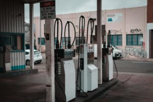 Iran War Fuel Costs Push American Shoppers to Rethink Every Purchase Driver pumping gas at a fuel station as prices rise