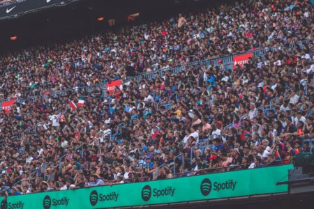 World Cup Ticket Chaos Leaves Fans Locked Out, Resellers Blamed Fans gathered outside a large sports stadium holding tickets and phones