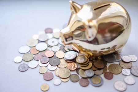 CD Rates Still Pay Two to Three Times the National Average Person reviewing bank savings account options at a desk