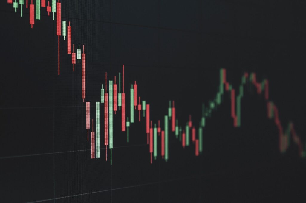 Stock market board showing declining tech sector prices during a volatile trading week