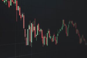 Stock market board showing declining tech sector prices during a volatile trading week