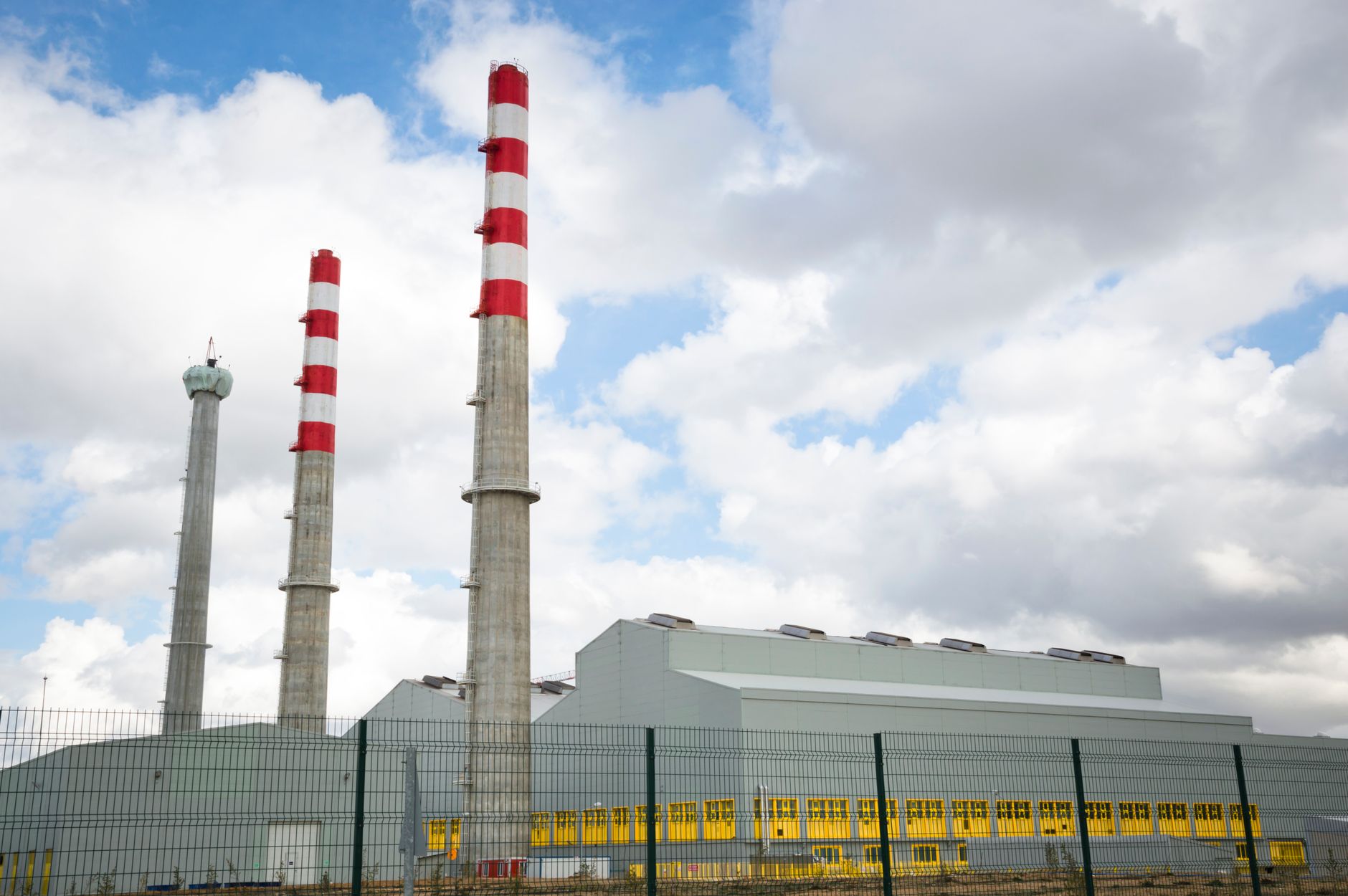 Industrial natural gas power generation facility with turbines and piping