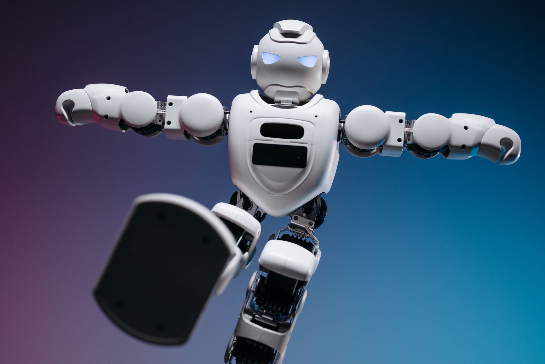 A humanoid robot in an industrial setting representing advanced robotics development
