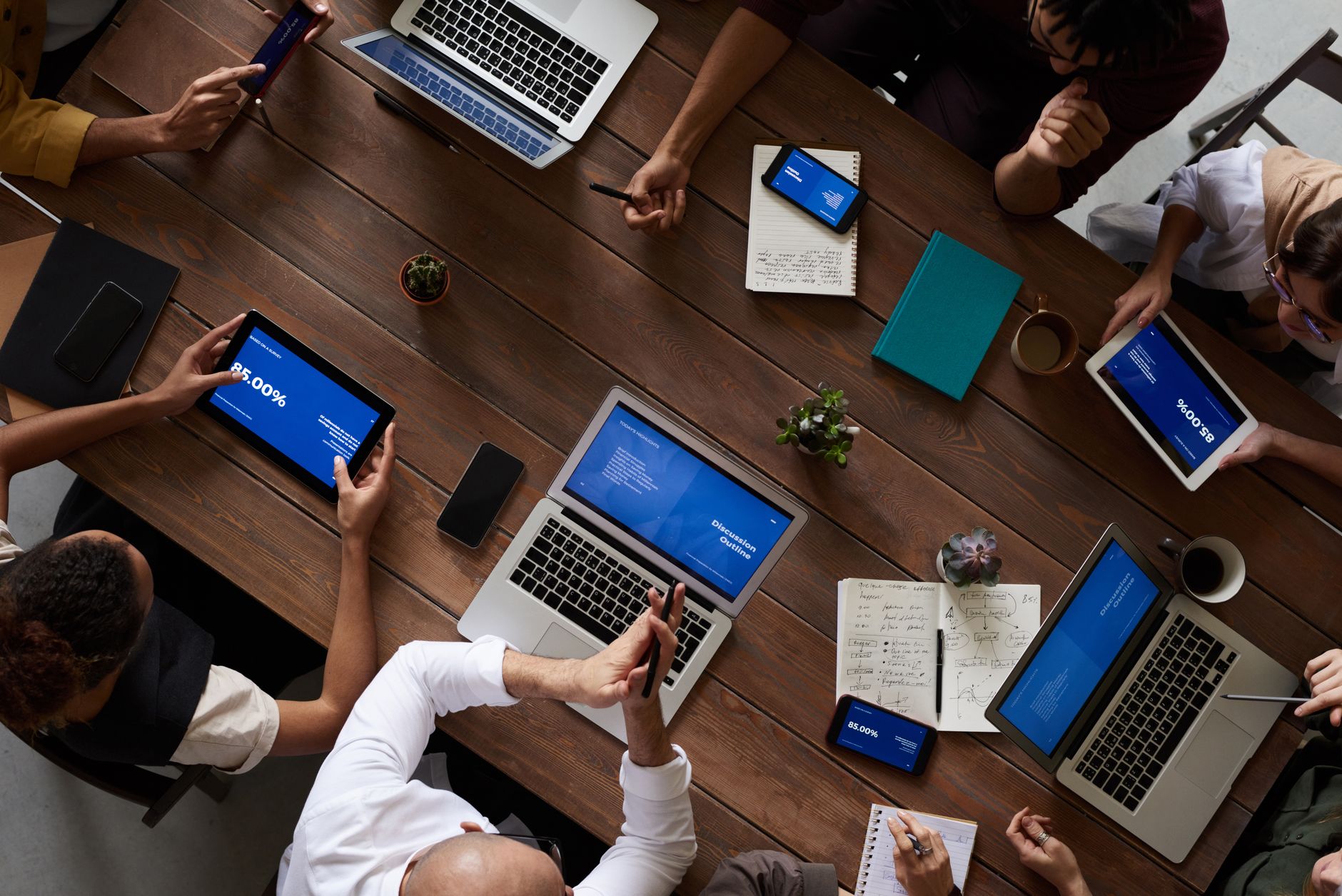 Business professionals in a meeting room discussing technology integration project planning