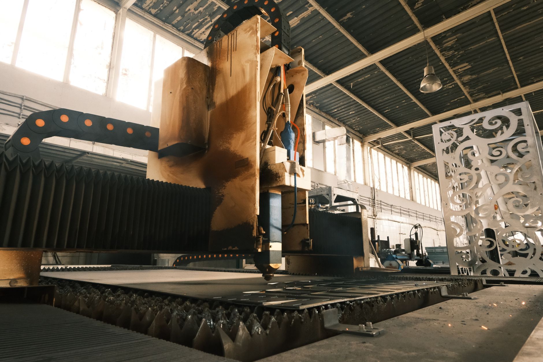 Workers on an automotive assembly line inside a manufacturing facility