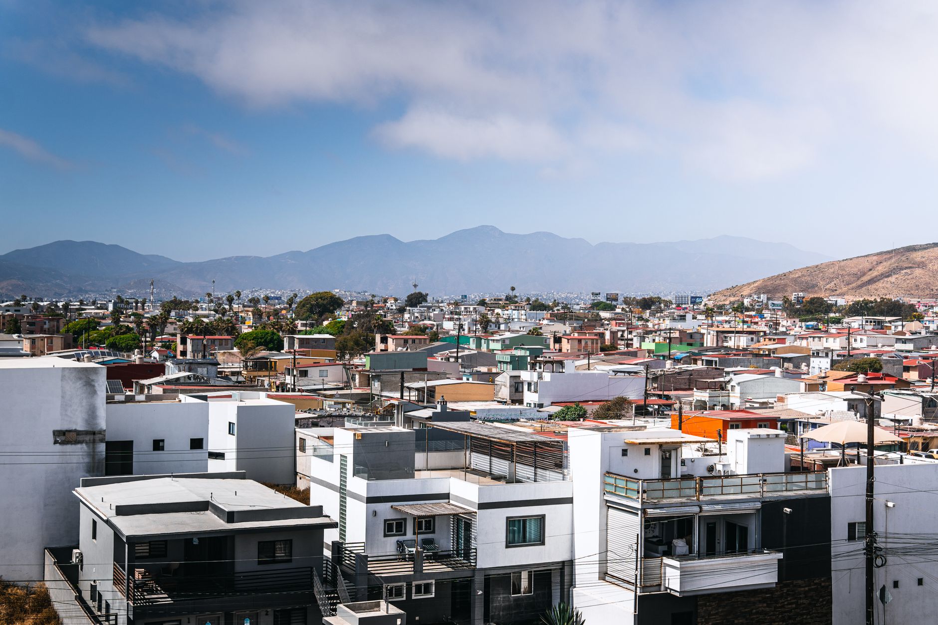 Street view of a busy urban area in Tijuana Mexico near the US border