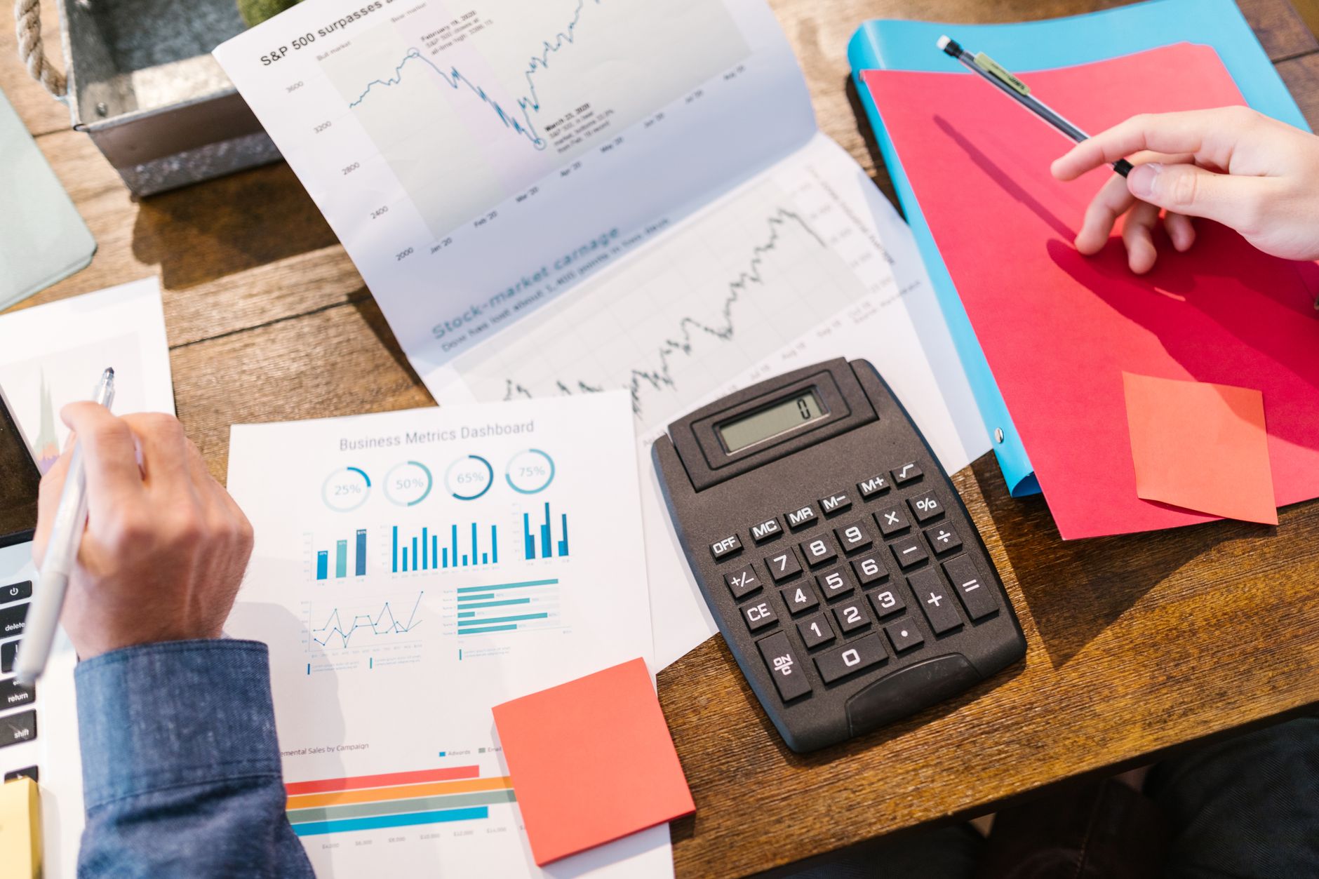Investor reviewing financial portfolio and risk exposure on a laptop at a desk