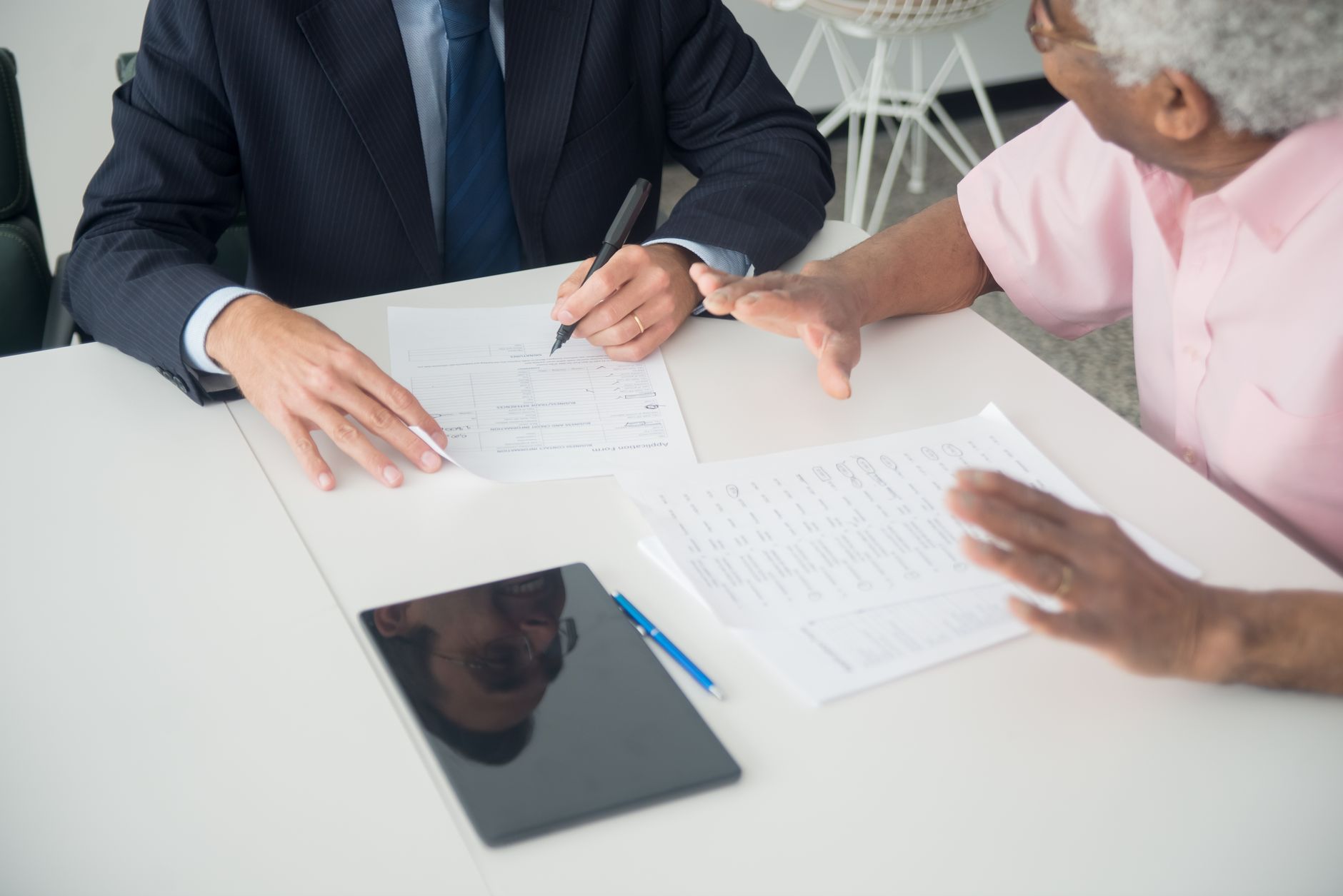 Financial advisor reviewing documents with a client