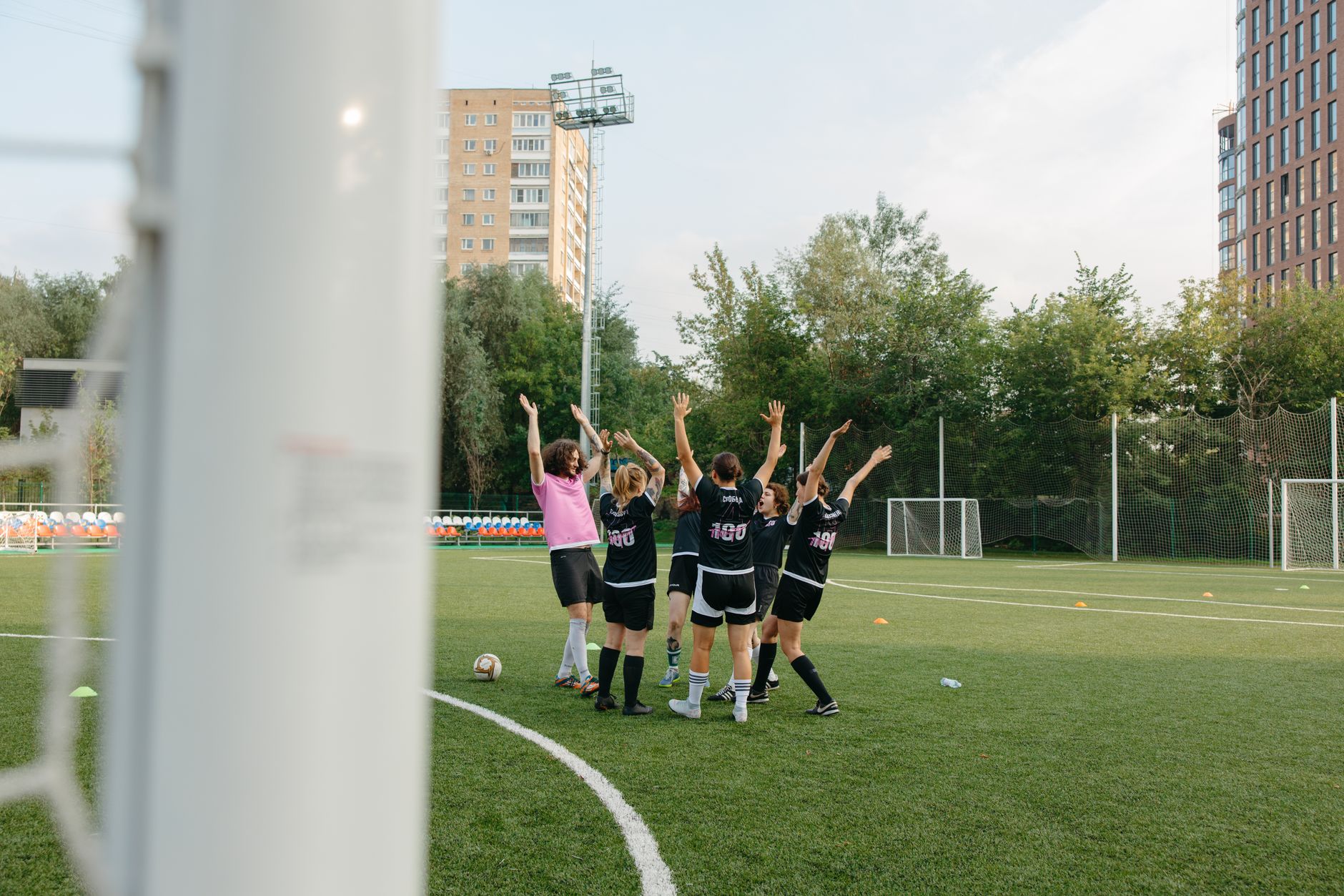 Football players celebrating after a match result on a large tournament stage