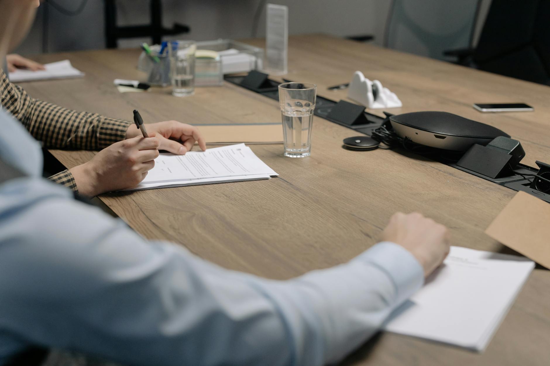 Business professionals reviewing financial documents at a desk