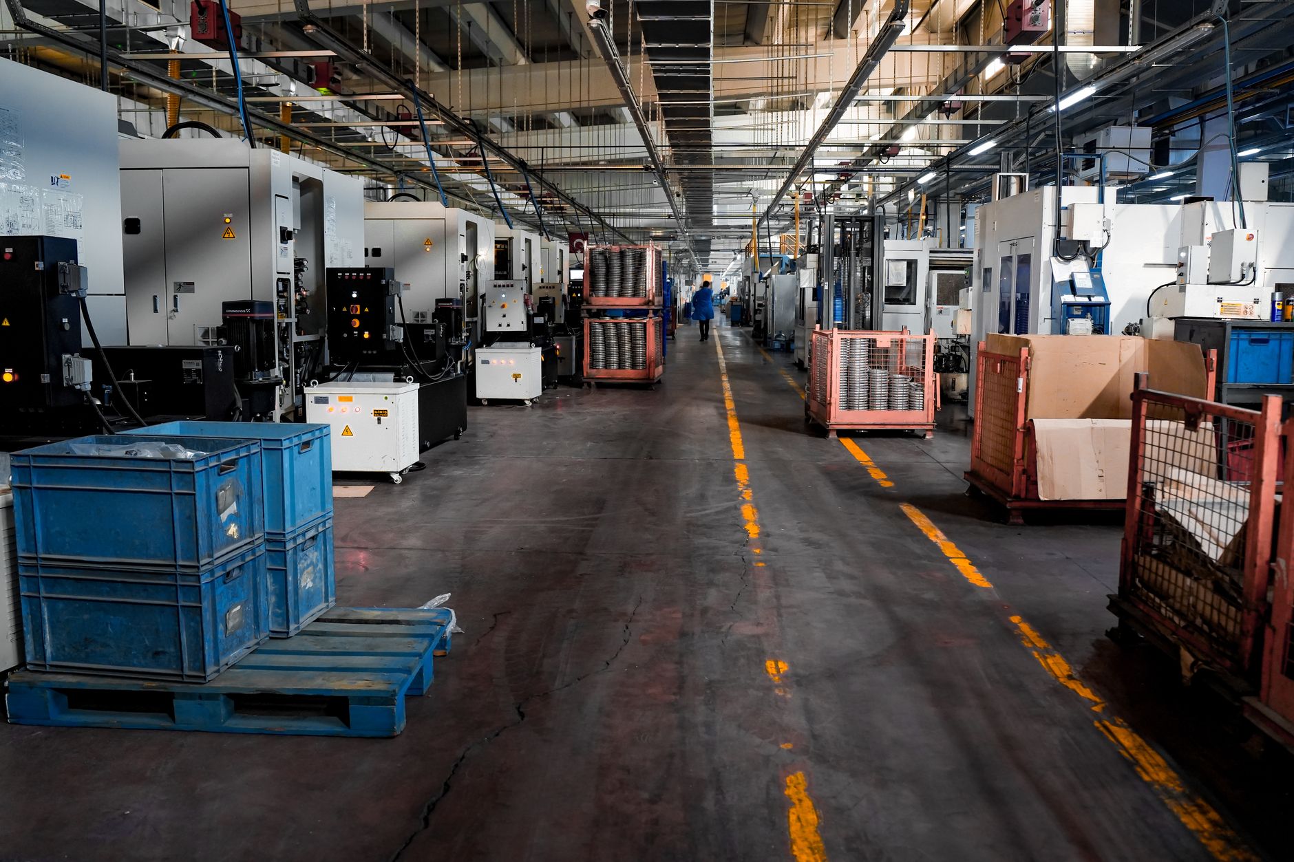 Interior of a large manufacturing facility with industrial equipment