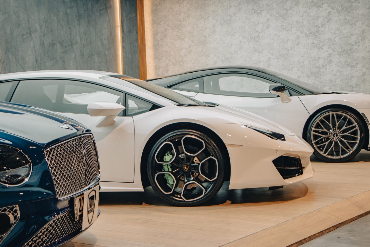 Audi vehicles on display in a premium car showroom