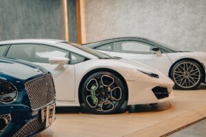 Audi half-year deliveries fall on China competition, US tariffs Audi vehicles on display in a premium car showroom