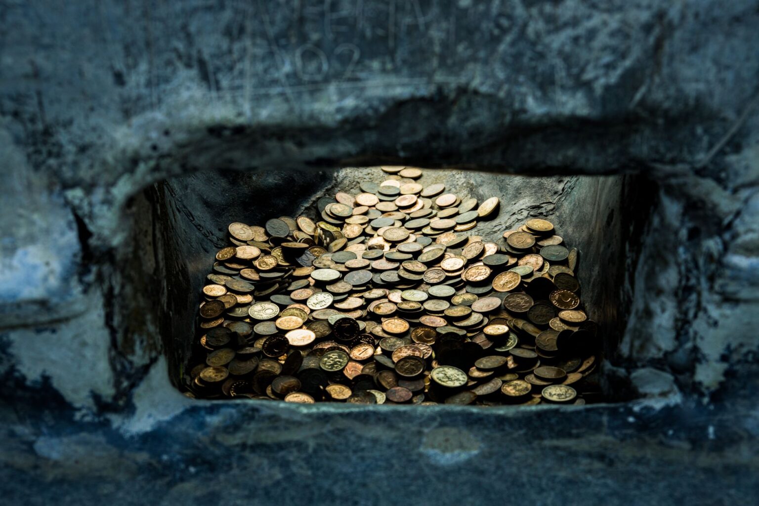 Stacked gold bars inside a secure vault representing physical bullion holdings