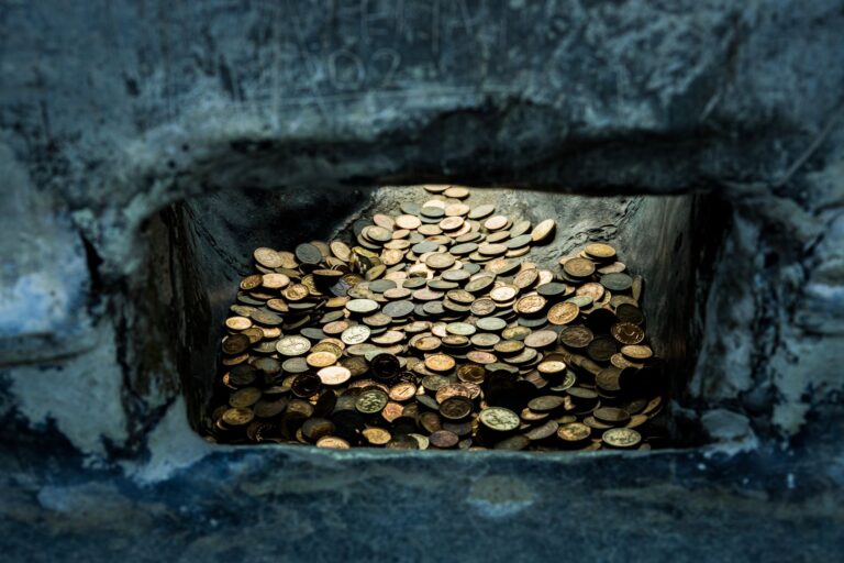 Stacked gold bars inside a secure vault representing physical bullion holdings