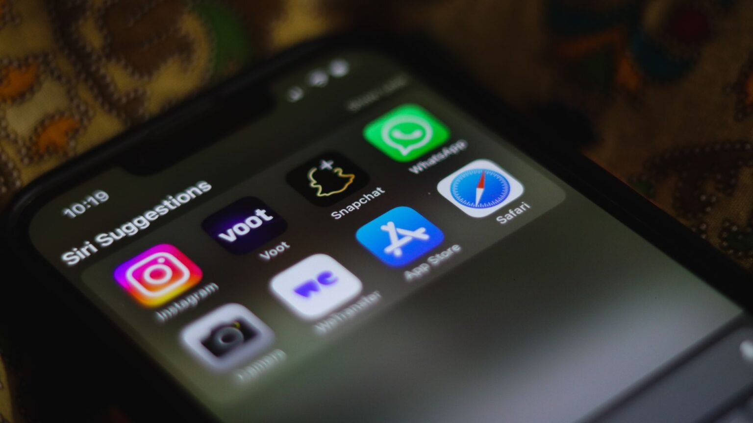 Person using a messaging app on a smartphone with notification alerts visible