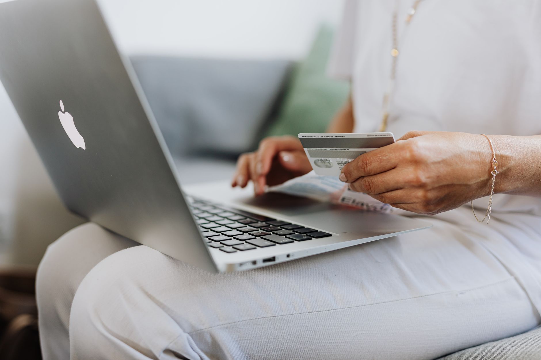 Person using laptop to manage online banking account