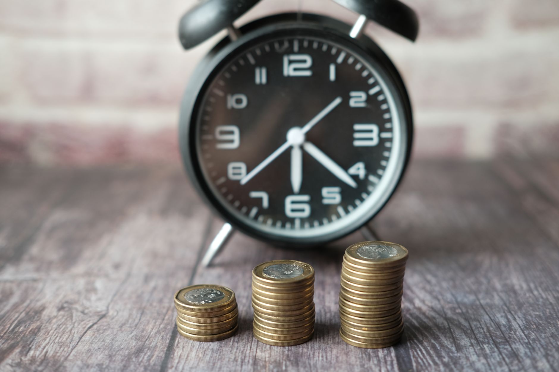 Financial charts showing rising interest rate trends on a monitor