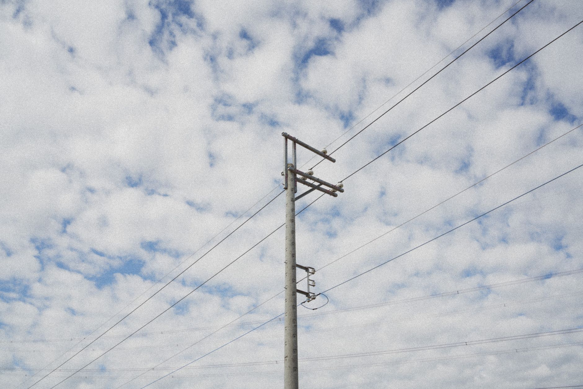 High-voltage power transmission lines representing energy infrastructure demands for AI