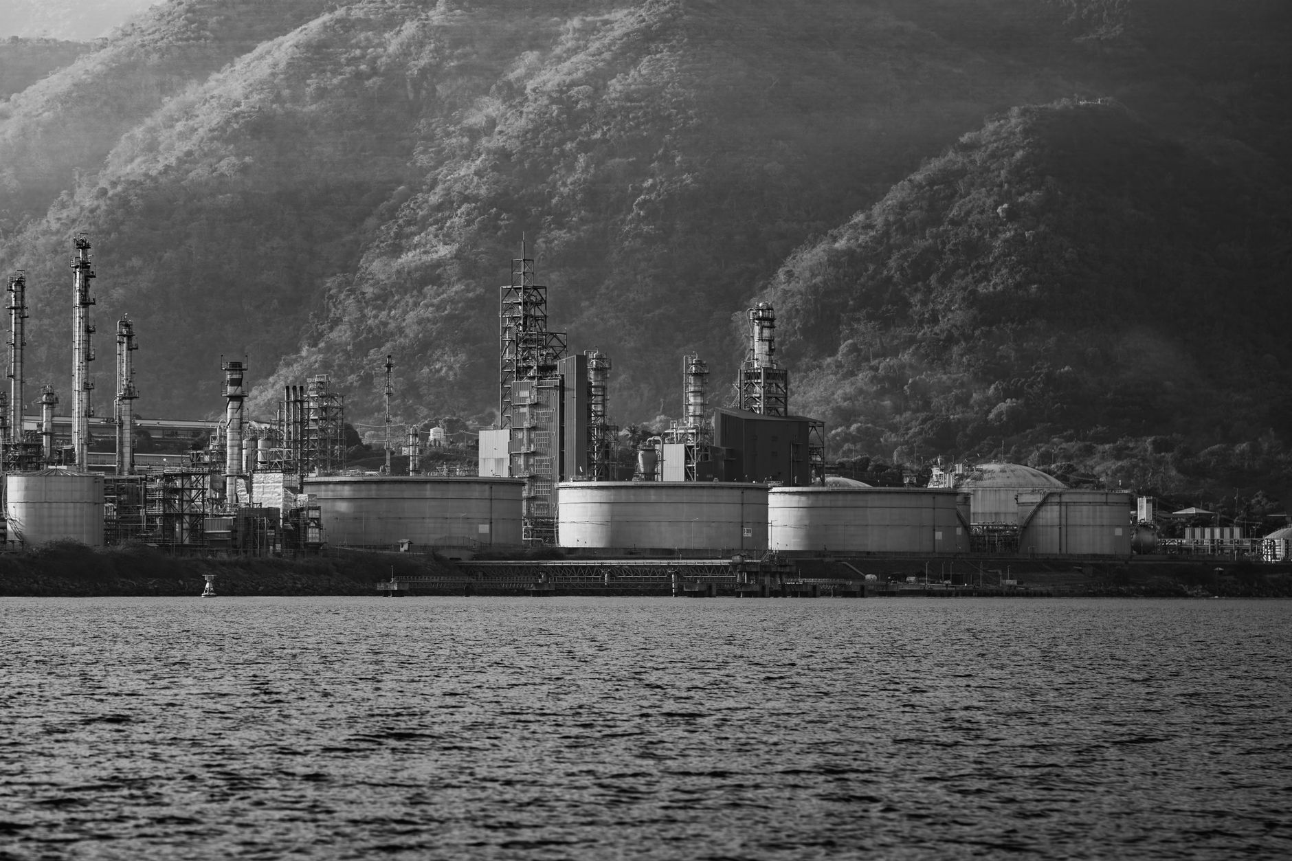 Oil refinery facility representing rising crude oil prices approaching $100 per barrel