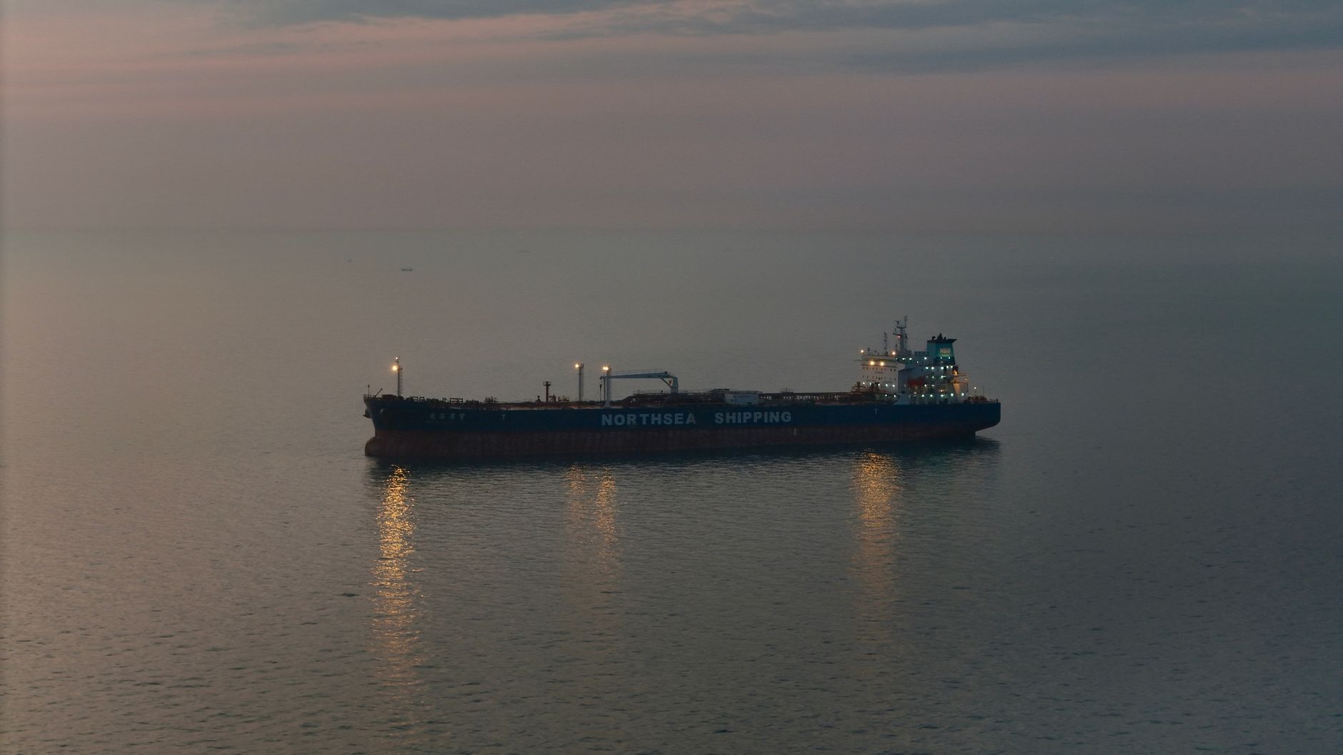 Large oil tanker navigating open water near a strategic shipping lane