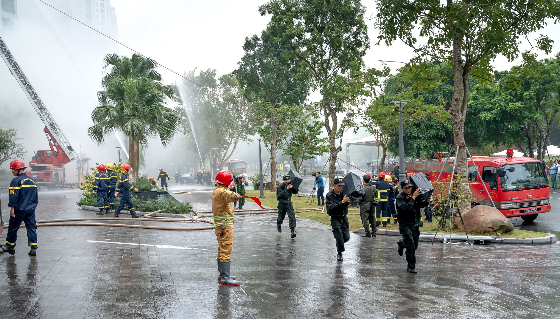 Firefighters responding to an emergency in an urban setting