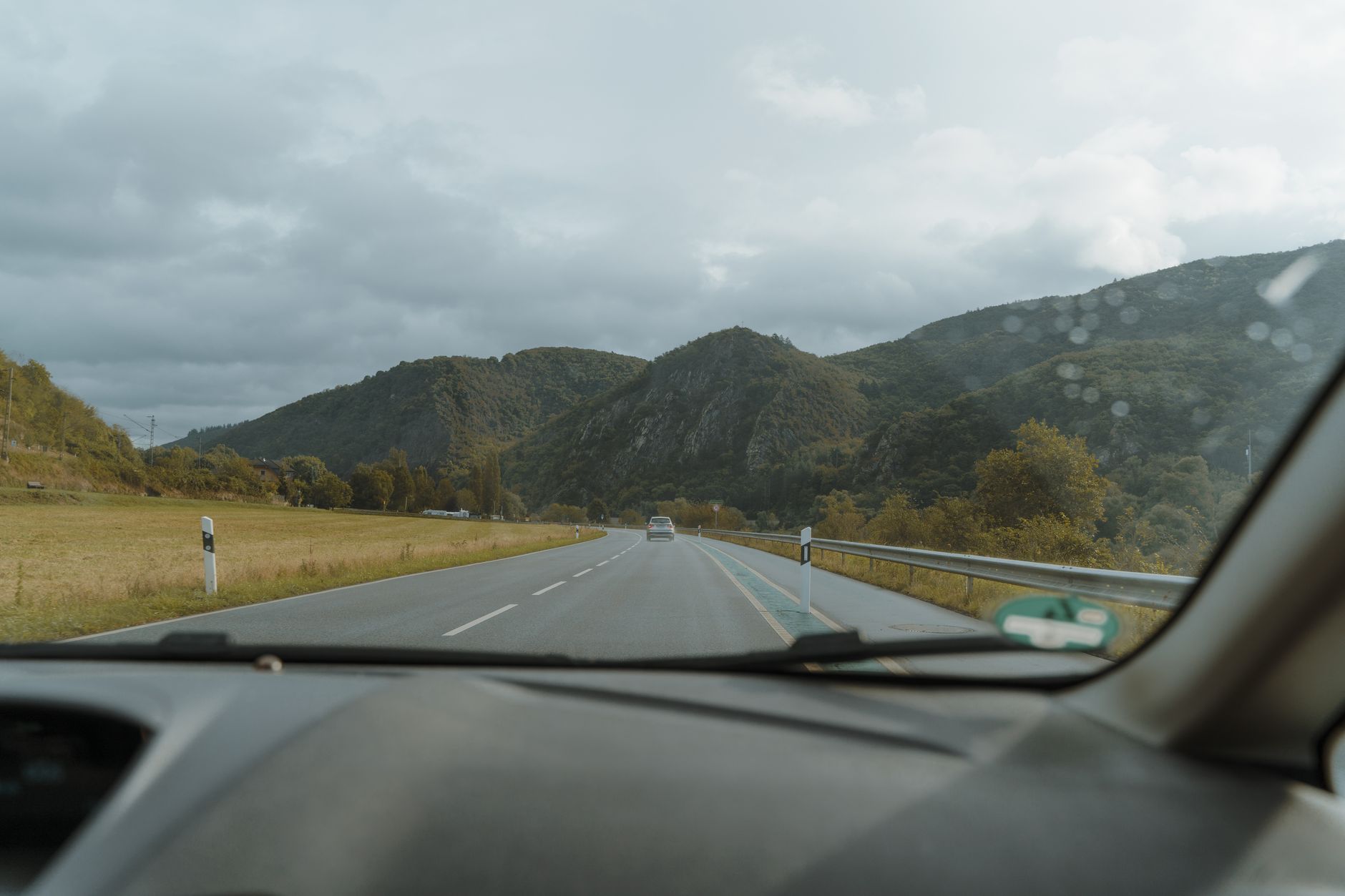 Cars driving on a wide American highway through open landscape