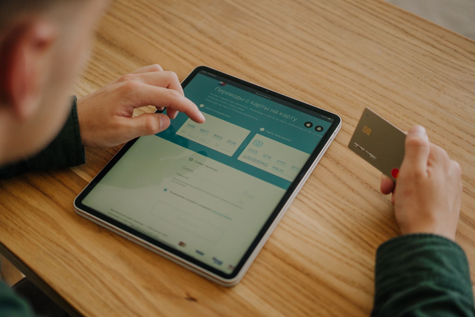 Person using a smartphone to manage an online savings account