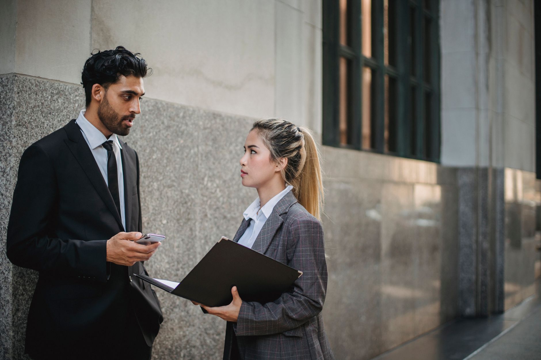 Two businesspeople in tense negotiation representing corporate pharmaceutical competition