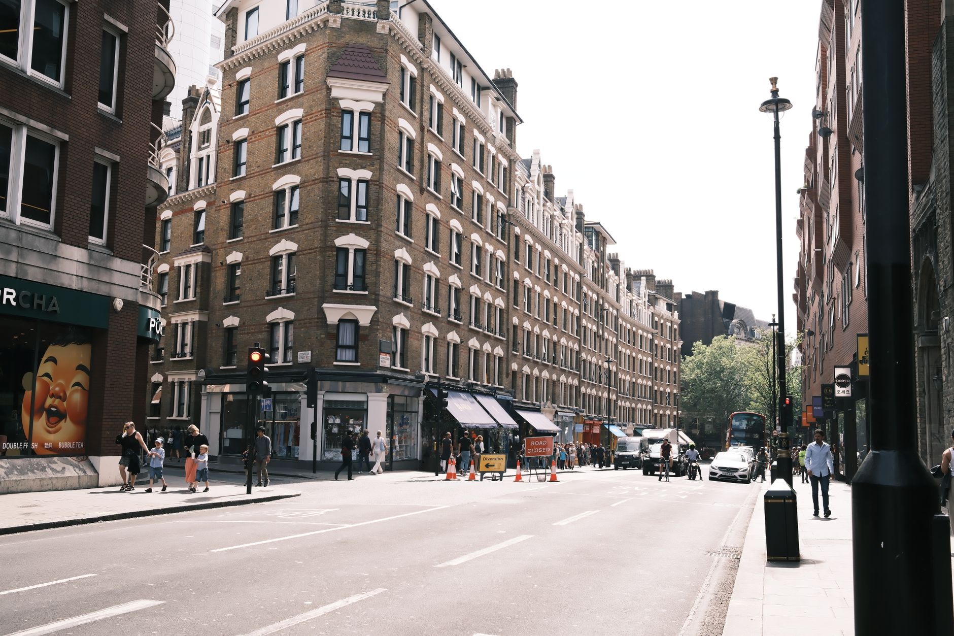 Busy London shopping street with upscale storefronts