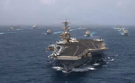 Naval Blockade Tightens Around Iran as Gulf States Intercept Projectiles U.S. naval warship patrolling open ocean during military operation