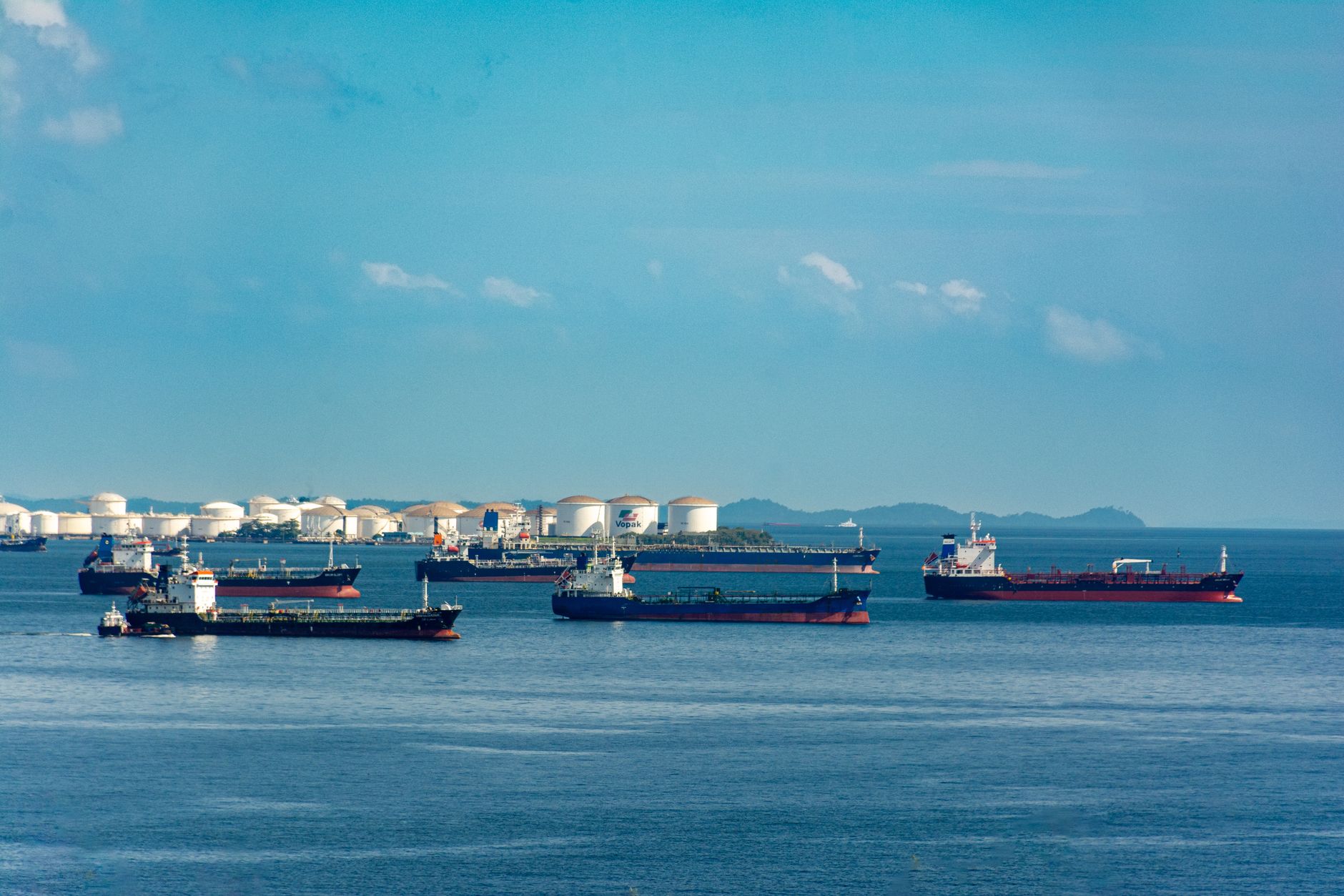 Large oil tanker crossing open ocean waters under overcast skies
