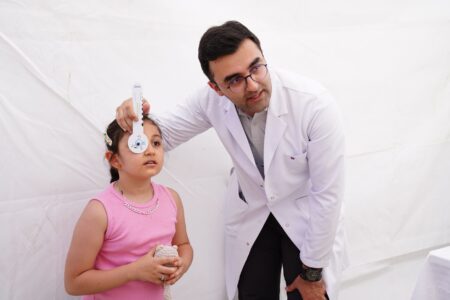 Pediatricians say Trump’s vaccine order could put kids at risk A pediatrician examining a young child during a routine well-child visit