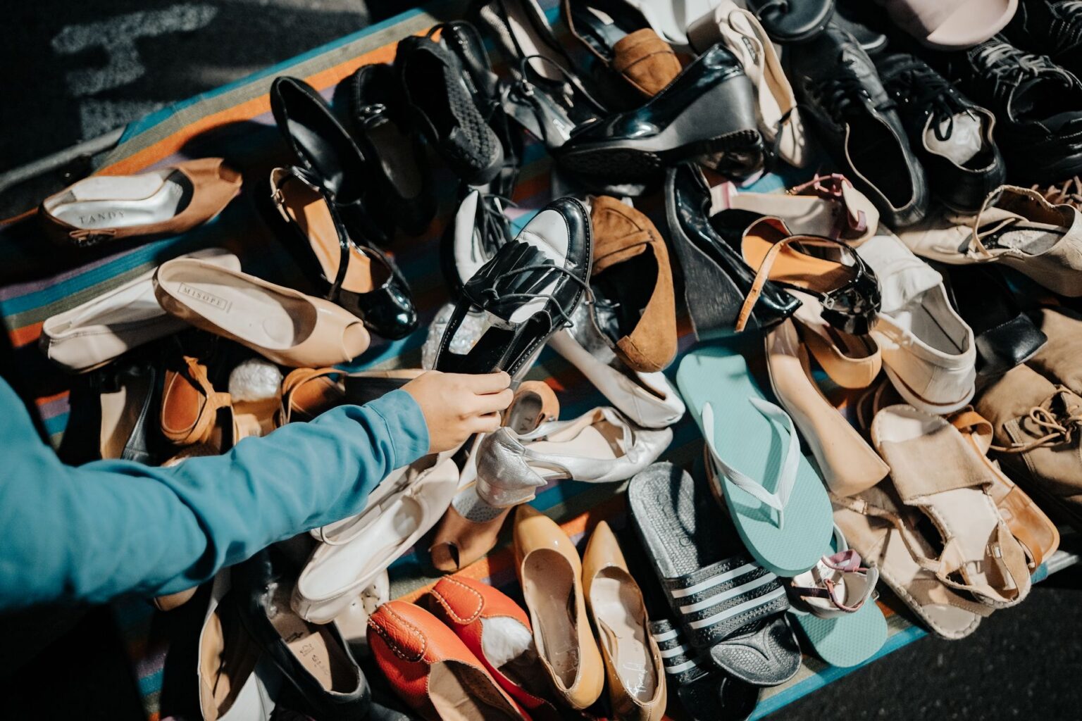 Premium sandals displayed on retail shelves at full price