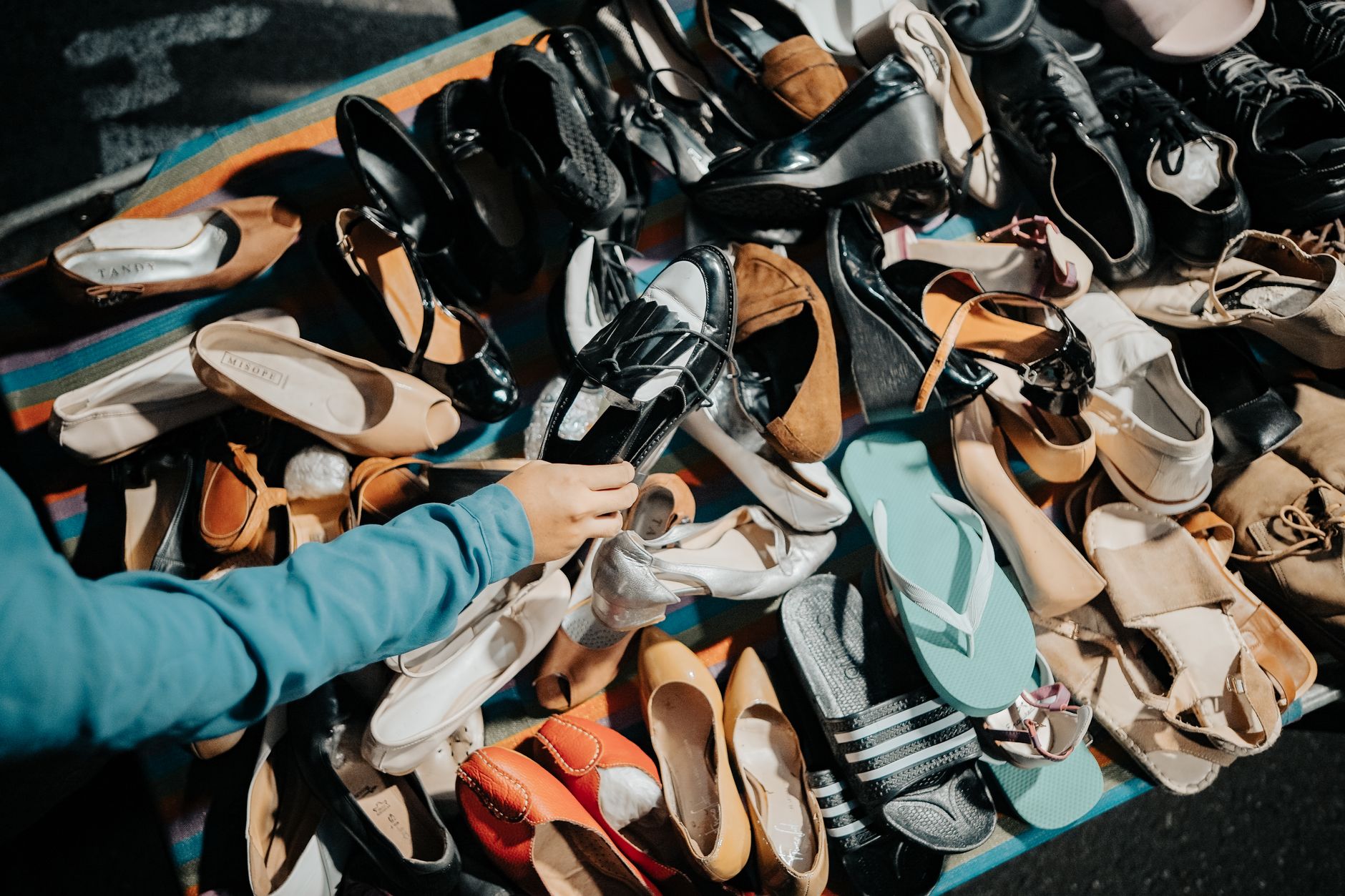 Premium sandals displayed on retail shelves at full price
