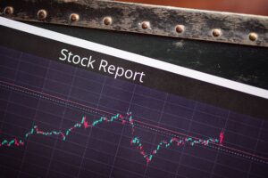 Stock market trading screens showing price movements and index levels
