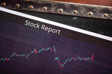 Stock market trading screens showing price movements and index levels