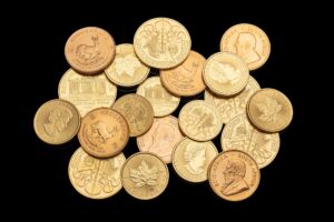 Stacked gold bars representing precious metal investment amid dollar weakness
